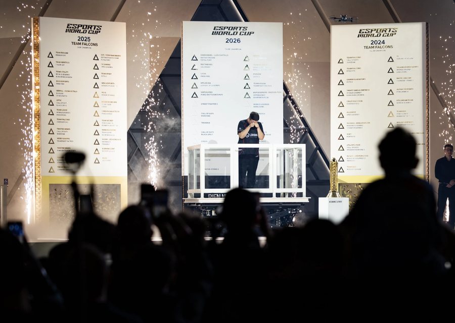 The main tournament stage with CHAMPION on screen and a light show