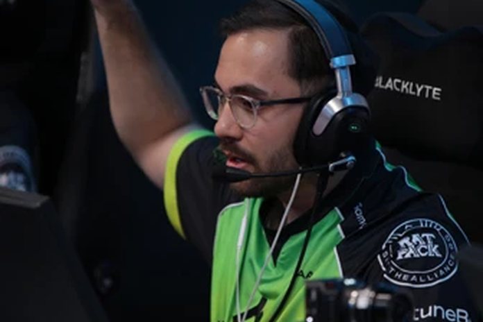 A CS2 player in a headset celebrating a won round